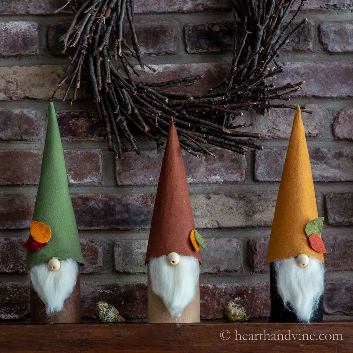 Three felt gnomes on a mantle